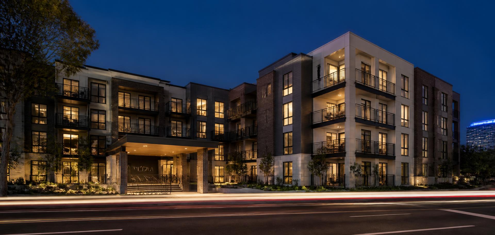 Modern multifamily apartment building at dusk